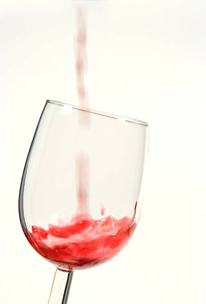 istock Red wine pouring into glass 115871394