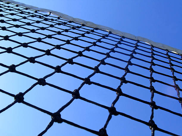 below the net shallow DOF in center of tennis net. Rich colour- very unique. wimbledon stock pictures, royalty-free photos & images