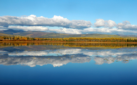 Regal mountain reflected upon a lake in the Wrangell St Elias national park and Preserve in Alaska