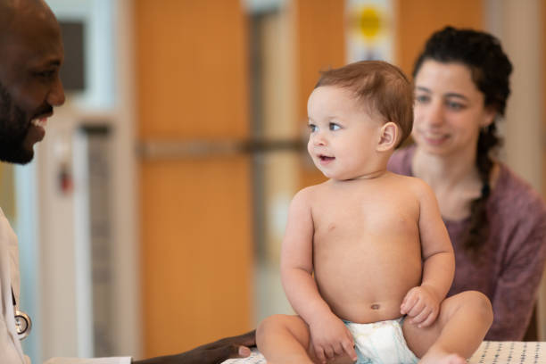 istock Baby with mother at routine medical appointment 1158716432