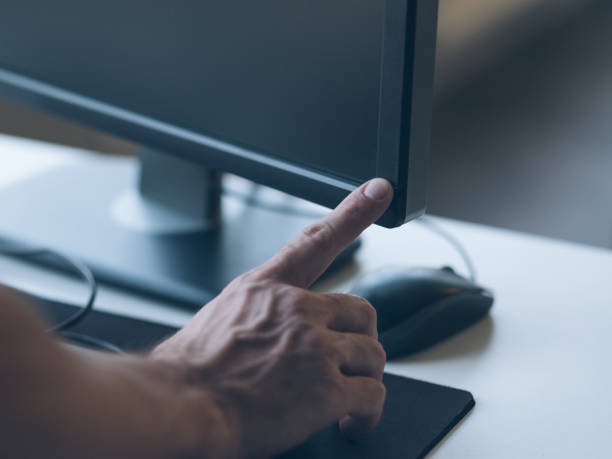 istock office worker routine man switching monitor on 1158716734