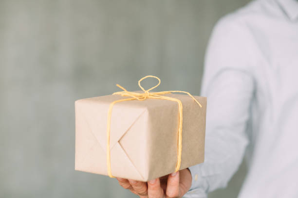 istock online food office delivery man wrapped box 1158716769