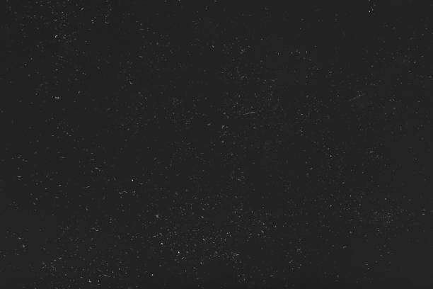 istock grunge distressed black background dust scratches 1158716790