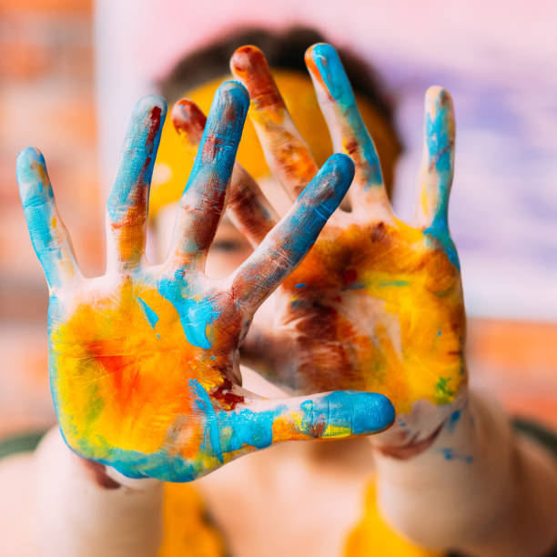 istock modern fine art course hands colorful paint 1158717312