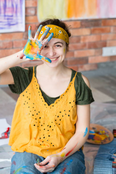 istock fine art hobby portrait lady fun smiling paint 1158717332