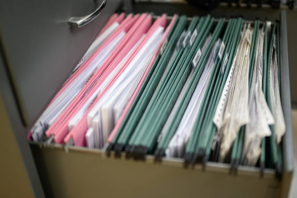 istock Employees are managing documents at the office. 1158718032