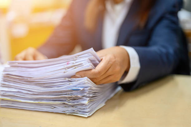 istock Employees are managing documents at the office. 1158718123