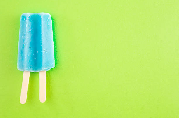 istock Blue Popsicle on a Bright Green Background 1158718125