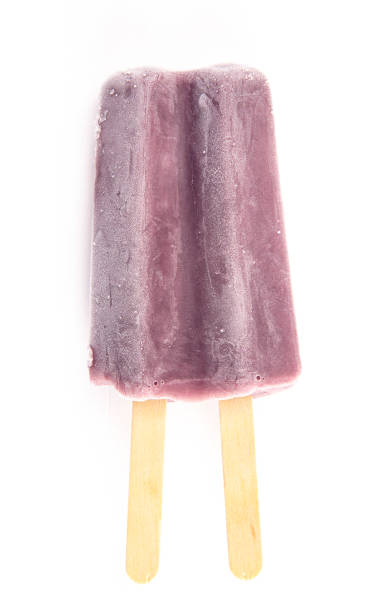 istock Purple Double Stick Popsicle Isolated on a White Background 1158718153