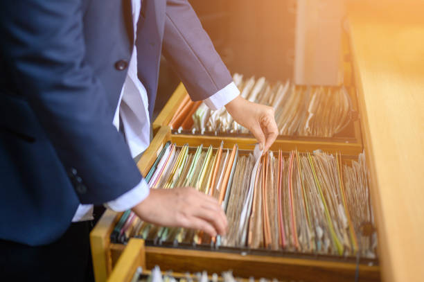 istock Employees are managing documents at the office. 1158718616