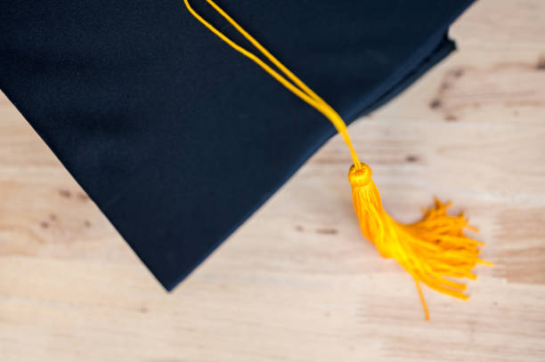 istock Black graduates hat hung on the blackboard 1158718632