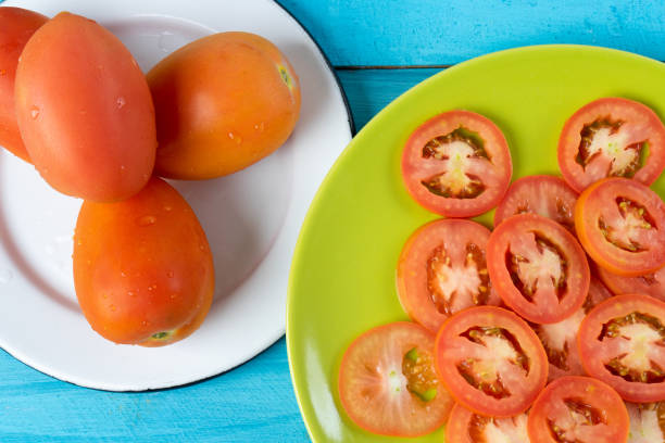 istock Slice and whole red tomato saladette 1158719032