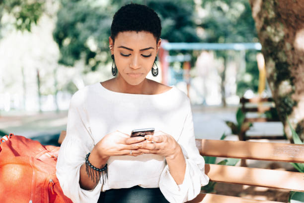 istock Black business woman texting on smartphone 1158720353