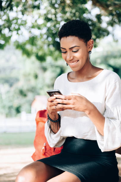 istock Black business woman texting on smartphone 1158720457