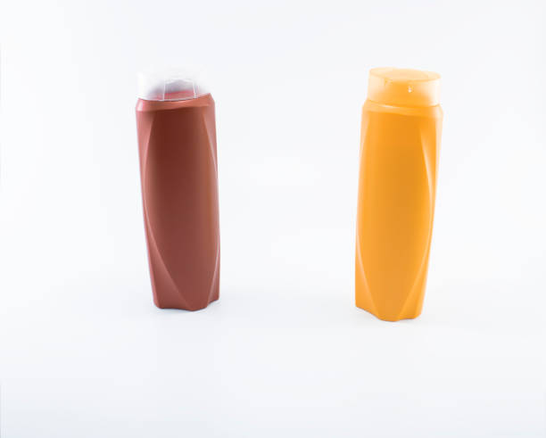 istock Shampoo, moisturizing bottles in brown, white, yellow colors. Shooting in white background. 1158721203