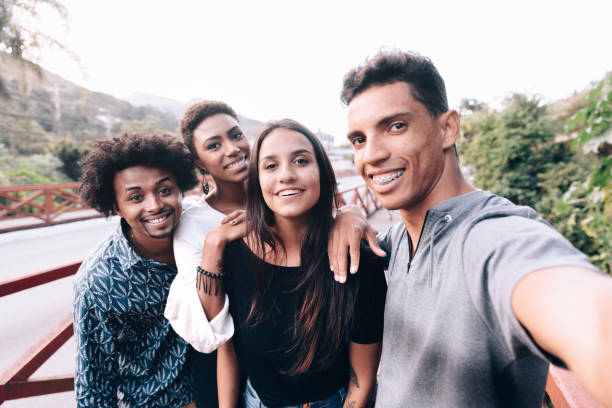 istock Group of friends taking a selfie with smartphone 1158721396