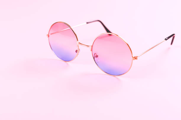 istock Round summer duotone sunglasses on pink background. 1158723249