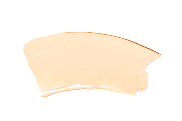 Liquid foundation smear isolated on white background. Liquid foundation smear or swatch isolated on white background. Beauty and makeup concept. liquid foundation face stock pictures, royalty-free photos & images