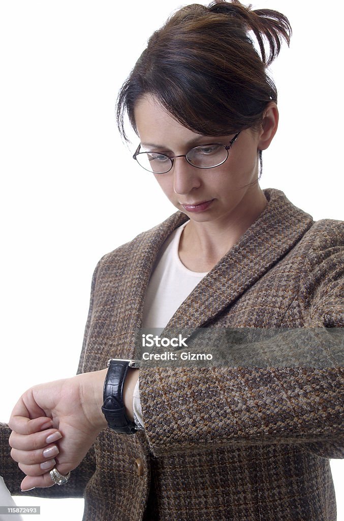 Busy Businesswoman Businesswoman looking at her watch. Adult Stock Photo