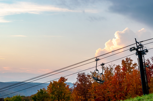 Ski lift of Mont Tremblant ski village, north shore of Montreal, during autumn at sunset in the month of October.