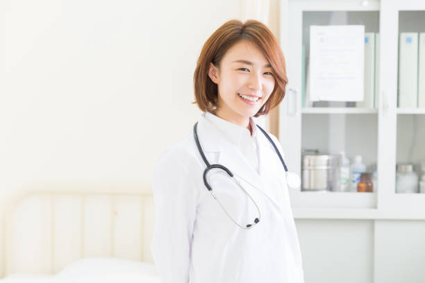 istock woman in a white coat 1158727376
