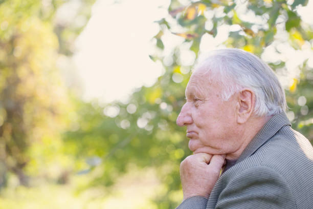 istock portrait of  elderly man in  park 1158729787