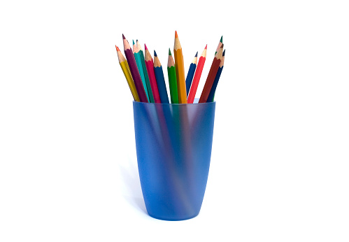 Color pencils in blue cup