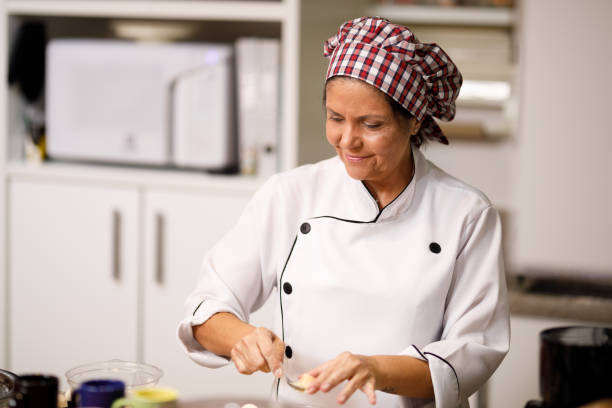 istock Confectioner preparing chocolate sweet - brigadeiro 1158735132