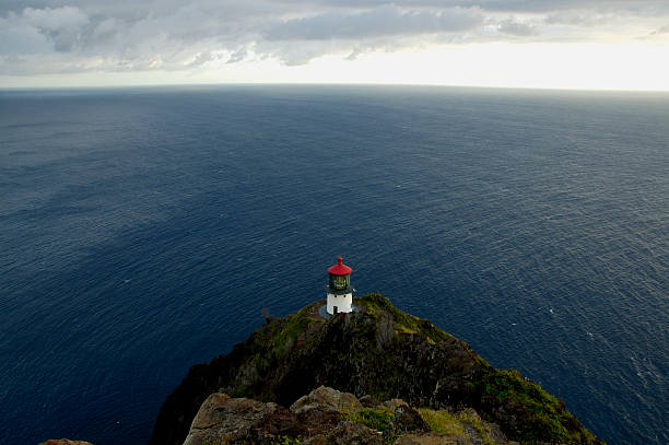 istock Oahu lighthouse and the Pacific Ocean during a stormy s 115873738