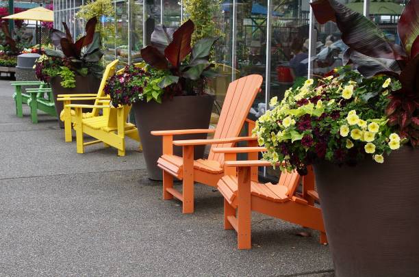 istock Row Of Colorful Adirondack Chairs 1158737442