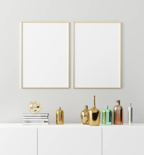 istock Poster frame mockup with stylish old vintage bottles on table on empty white wall background 1158739453