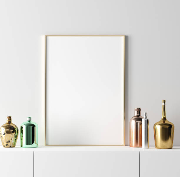 istock Poster frame mockup with stylish old vintage bottles on table on empty white wall background 1158739472