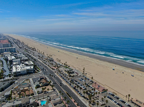 Aerial view of Huntington Beach and coastline during hot blue sunny summer day, Southeast of Los Angeles. California. destination for  holiday and surfer