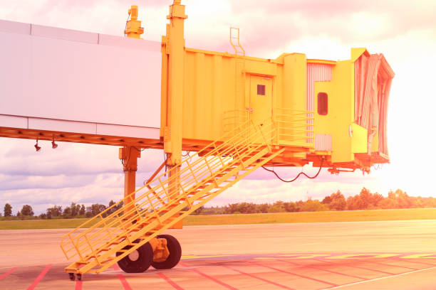 istock Jetway connected to the airplane for boarding passengers. Boarding bridge. 1158742263