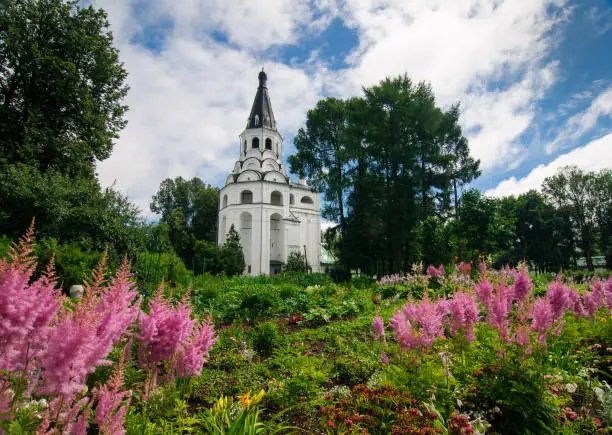 Monastery garden in front Raspyatskaya church-bell tower in Alexandrovskaya Sloboda, Russia.