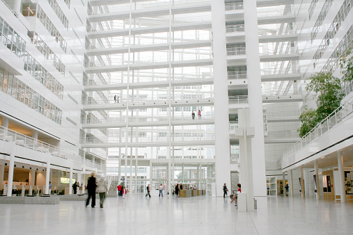 Inside a huge white public building.