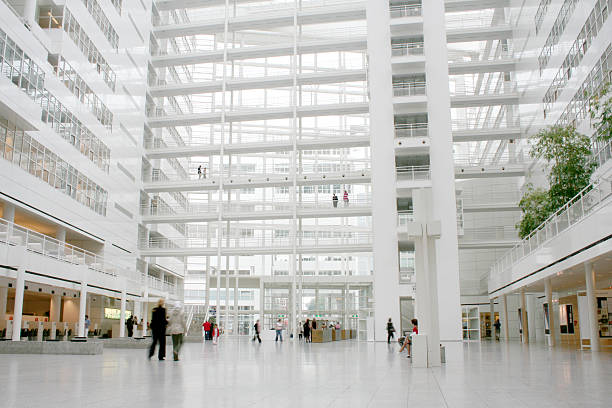 Public space Inside a huge white public building. dutch architecture stock pictures, royalty-free photos & images