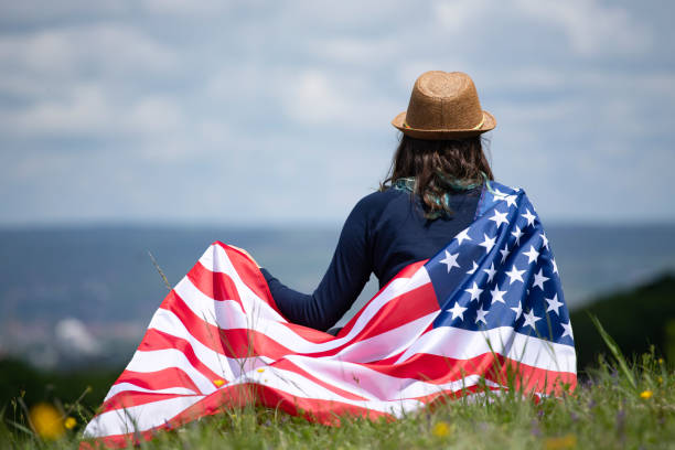 istock Woman with USA flag. 1158746513