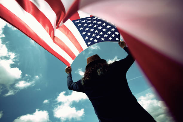 istock Woman with USA flag. 1158746568