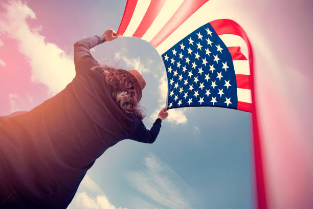 istock Woman with USA flag. 1158747118