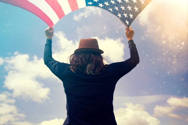 istock Woman with USA flag. 1158747167