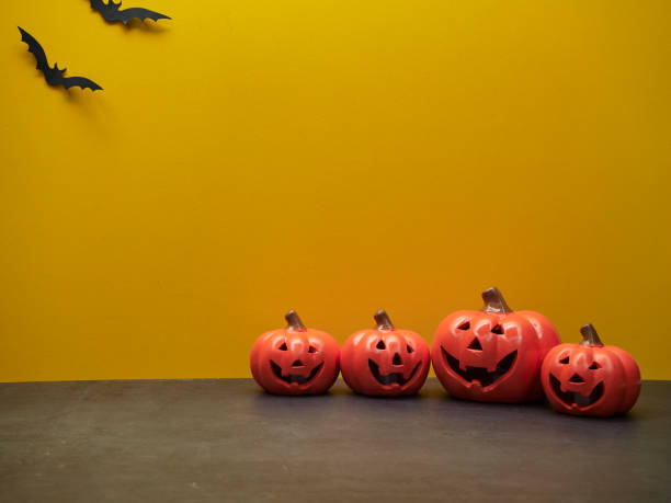 istock Halloween pumpkin decoration on a yellow background 1158747362