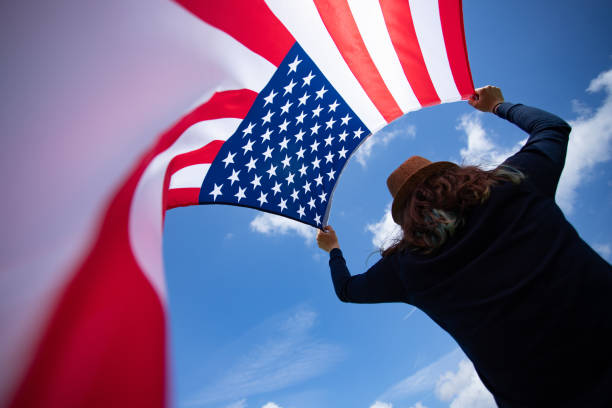 istock Woman with USA flag. 1158747987