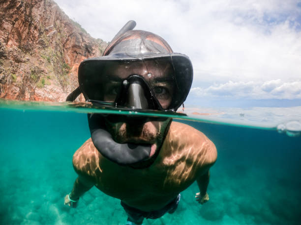 istock Man with scuba mask face close up 1158748031