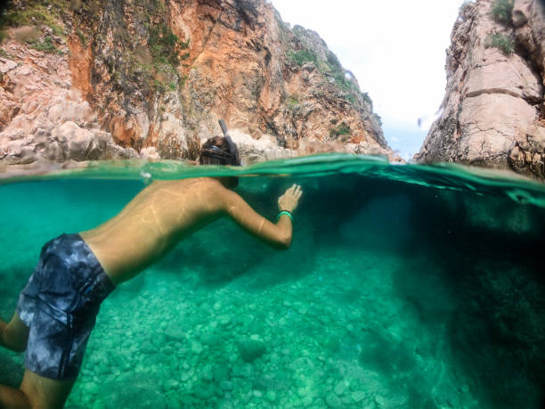 istock Man snorkeling in the sea 1158748088