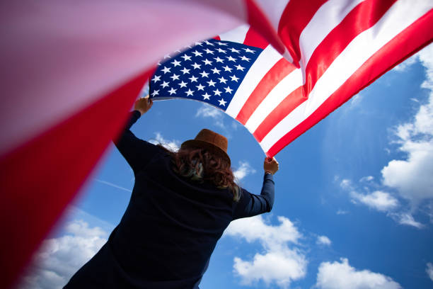 istock Woman with USA flag. 1158748089