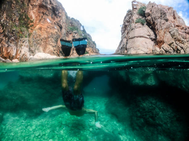 istock Man snorkeling in the sea 1158748103