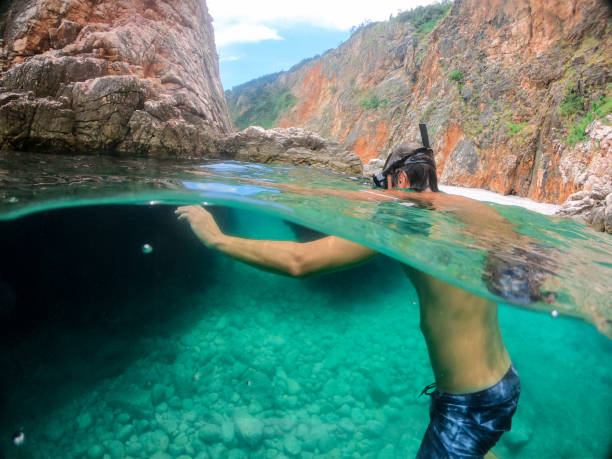 istock Man snorkeling in the sea 1158748126