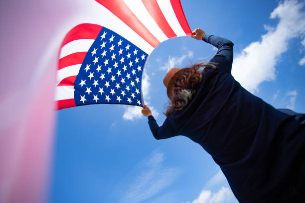 istock Woman with USA flag. 1158748196