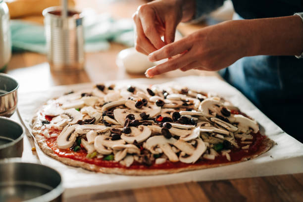 istock making homemade vegetarian pizza 1158748199
